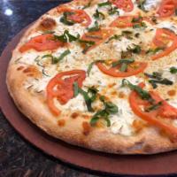 Alla Rosa Pizza  · Ricotta cheese, fresh slice tomato, fresh garlic, fresh basil, mozzarella cheese, pecorino R...