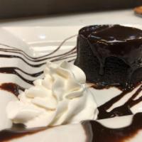 Bourbon Chocolate Cake  · Sal's signature dessert. Warm chocolate cake filled with white chocolate mousse, cream chees...