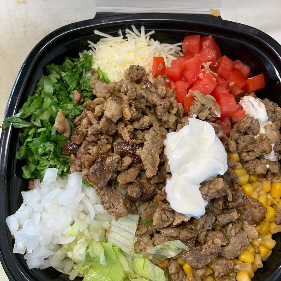 Burrito Bowl · Your choice of meat on a bed of rice and beans, topped with lettuce. tomato, cilantro, onion, corn, sour cream and shredded cheese.

