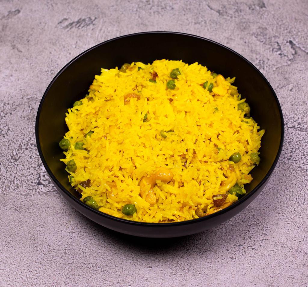 Rice Pulao · Lightly fried rice with peas and a touch of cumin seeds.