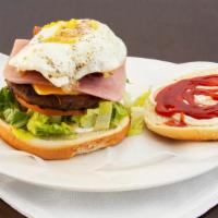 Craving Burger · Served with egg, bacon, cheese, ham, lettuce, tomatoes and french fries.