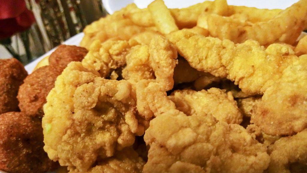 Catfish Nuggets with Fries · Delicious mouthwatering catfish nuggets served with crispy golden fries and hush puppies with your choice of your favorite dipping sauce. Add condiments  for an additional charge. 