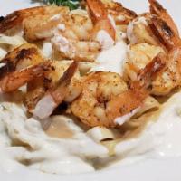 Frank’s Fettuccine Shrimp Alfredo · Half a pound of seasoned shrimp, grilled and tossed in a creamy Alfredo sauce with fettuccin...