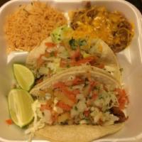 Fish Tacos · Cabbage, pico de gallo, and tartar sauce.