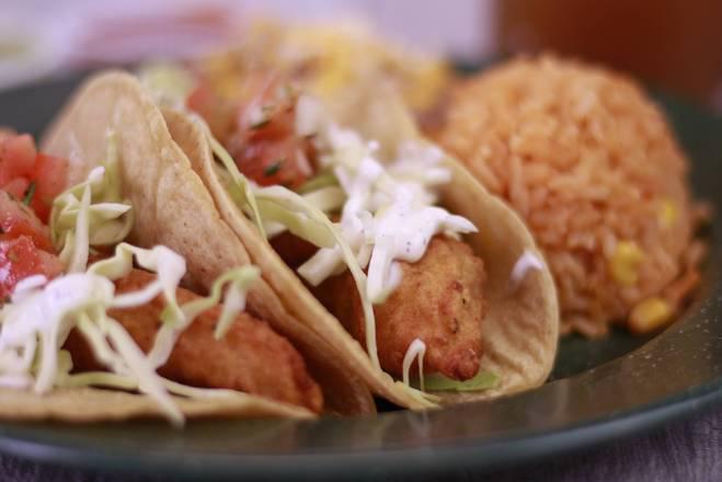 * 2 - Two Fish Tacos + Rice ＆ Beans · Beer batter fish, cabbage, salsa fresca, house sauce, rice and beans. Includes  drink. Includes 22 ounce. Drink. Additional items for an additional charge.