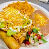 Rolled Taco Combo · 4 deep fried rolled tacos served with beans and rice. Topped with lettuce, sour cream, guaca...