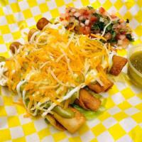 9 Rolled Tacos · 9 deep fried rolled tacos. Topped with lettuce, sour cream, guacamole, shredded cheese and p...