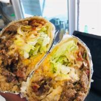Supreme Burrito · Your choice of meat, refried beans, rice, shredded cheese, lettuce, pico de gallo, sour crea...