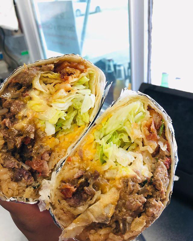 Supreme Burrito · Your choice of meat, refried beans, rice, shredded cheese, lettuce, pico de gallo, sour cream and fresh guacamole.