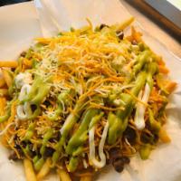 Super Fries · French fries topped with your choice of meat, fresh guacamole, sour cream and shredded chees...