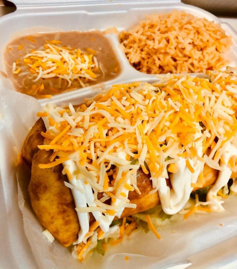 Chimichanga · Deep-fried burrito filled with your choice of meat, shredded cheese and refried beans. Topped with guacamole, sour cream, shredded cheese, lettuce and pico de gallo.