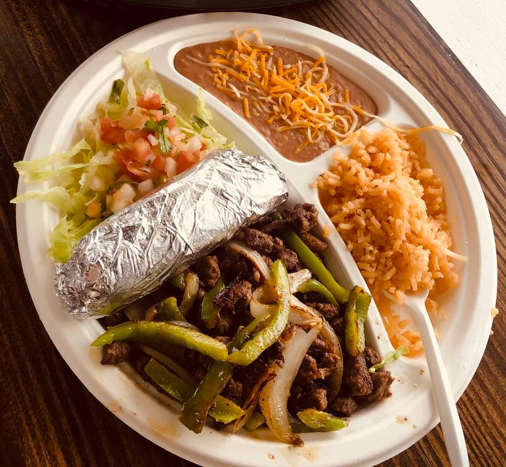 Fajita Combination Plate · Steak cooked with bell pepper & onions. Served with a side of rice, beans, lettuce,pico de gallo, sour cream & 6 corn tortillas.