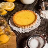 Lemon Tart · Crispy pastry filled with a sweet, tart lemon filling.  Crafted with imported French butter!