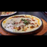 Queso Fundido (with 3 flour tortillas) · Shredded cheese layered with chorizo, queso cheese and pico de gallo served in a with 3 flou...