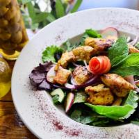 Grilled Salad · Green salad topped with choice of chicken kabob or shawarma, gyro, beef kabob or shawarma, s...