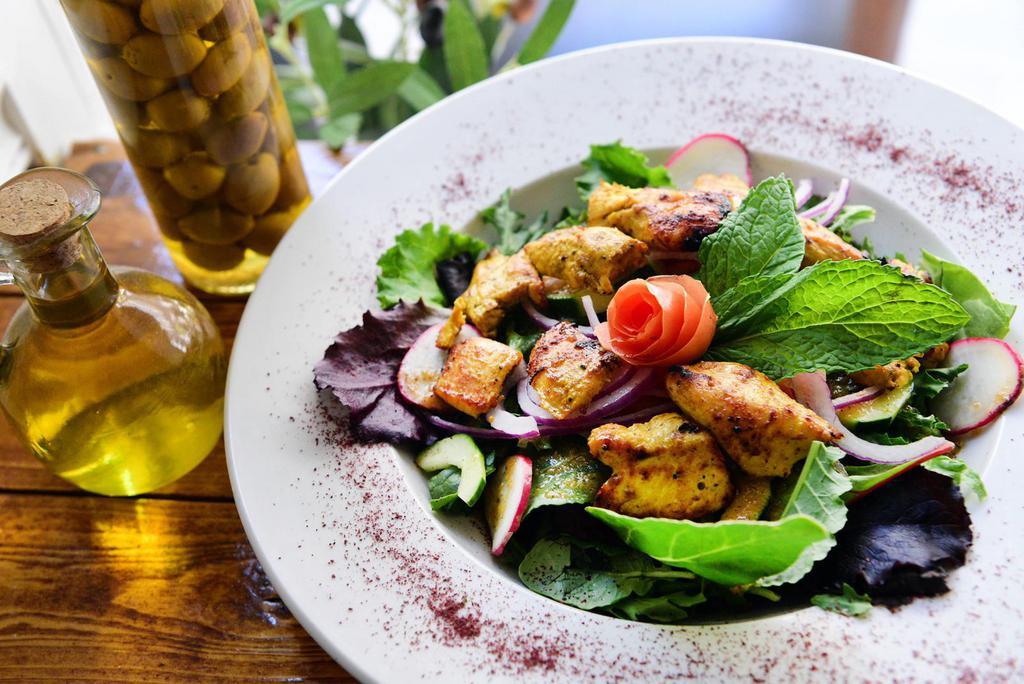 Grilled Salad · Green salad topped with choice of chicken kabob or shawarma, gyro, beef kabob or shawarma, shrimp or lamb kabob.