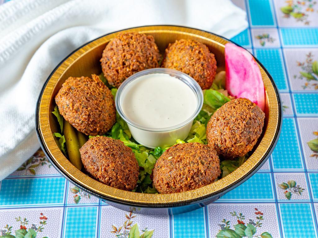 Falafel pieces · Chickpeas mixed with fresh herbs and spices. Vegan, gluten free. Come with tahini dipping sauce. 