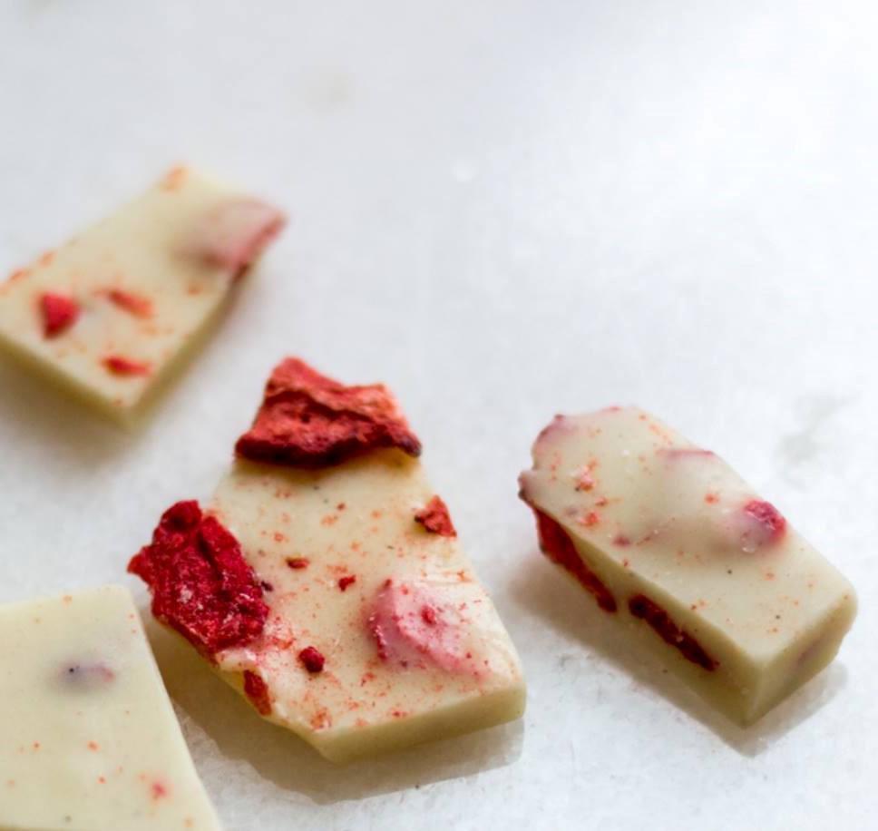 Strawberries and Cream Bark · Buttery top notes highlight a creamy mouthfeel balanced with tangy fruit. 

Ingredients: White Chocolate (Cane Sugar, Cocoa Butter, Whole Milk Powder, Emulsifier [Soya Lecithin], Natural Vanilla Extract), Freeze-Dried Strawberries. Contains Soy and Milk. May Contain Traces of Tree Nuts, Peanuts, Wheat, and Eggs.