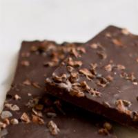 Extra Dark with Nibs Bark · Savory dark chocolate with 85% cocoa topped with cacao nibs.  This chocolate has a strong co...