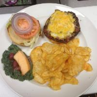 Classic Burger  · a fresh 8 oz Prime Black Angus burger simply topped with lettuce, tomatoes and red onions. C...