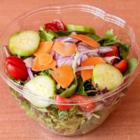 Mixed Green Salad · Mixed greens, cherry tomato, cucumber, onion, shredded carrots and croutons. Served with pit...