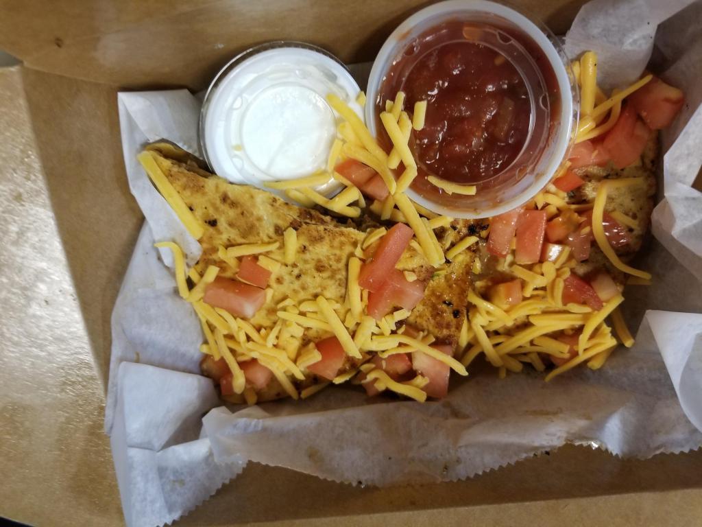 quesadillas · cheddar cheese, onions peppers, fresh tomatoes served with salsa and sour cream, plain steak and chicken available,