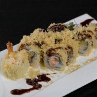 E31. Crunch Roll · Shrimp tempura inside, crunch flakes on top with eel sauce.