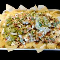Nachos · Tortilla chips topped with refried beans, melted cheese, pico de gallo, jalapenos, sour crea...