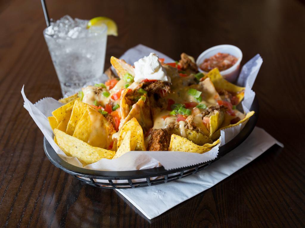 Southewest Nachos · Fresh fried tortilla chips loaded with chili, pulled pork, white queso, tomatoes, green onion and sour cream. Salsa served on the side.