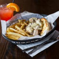 Philly Steak Sandwich · Tender beef grilled with onions and green peppers then topped with melted Swiss cheese on a ...