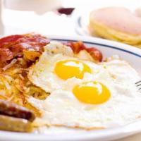 2 Eggs Special Breakfast · home fries ,Eggs with bacon, ham, or sausage. With a Cuban toast