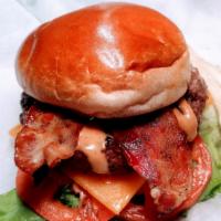 Big Bacon Chz Burger · ½ lb. beef burger, cheddar, bacon, lettuce tomatoes and bite down sauce on brioche.