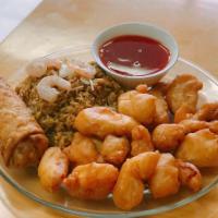 06. Sweet and Sour Chicken Dinner Combo 甜酸鸡 · Sauce served on the side. Served with fried rice and an egg roll.