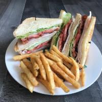 Turkey Club Sandwich · Turkey , lettuce , tomatoes , Mayo & bacon 