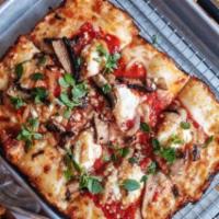The Mimi Pie · Tomato sauce, ricotta, roasted garlic, mushrooms, and basil.