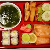 Grilled Salmon Bento Box · Served with steamed rice, house salad, miso soup, 2 pieces veggie egg roll, 2 pieces fried g...