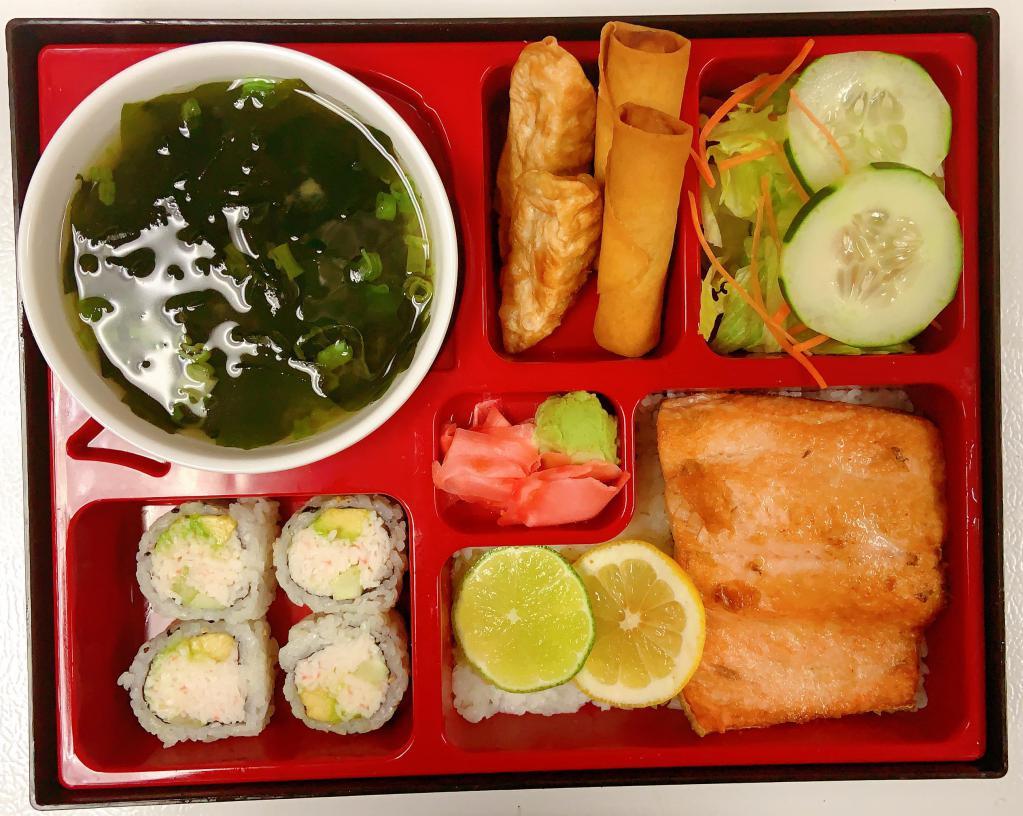 Grilled Salmon Bento Box · Served with steamed rice, house salad, miso soup, 2 pieces veggie egg roll, 2 pieces fried gyoza and 4 pieces California roll.