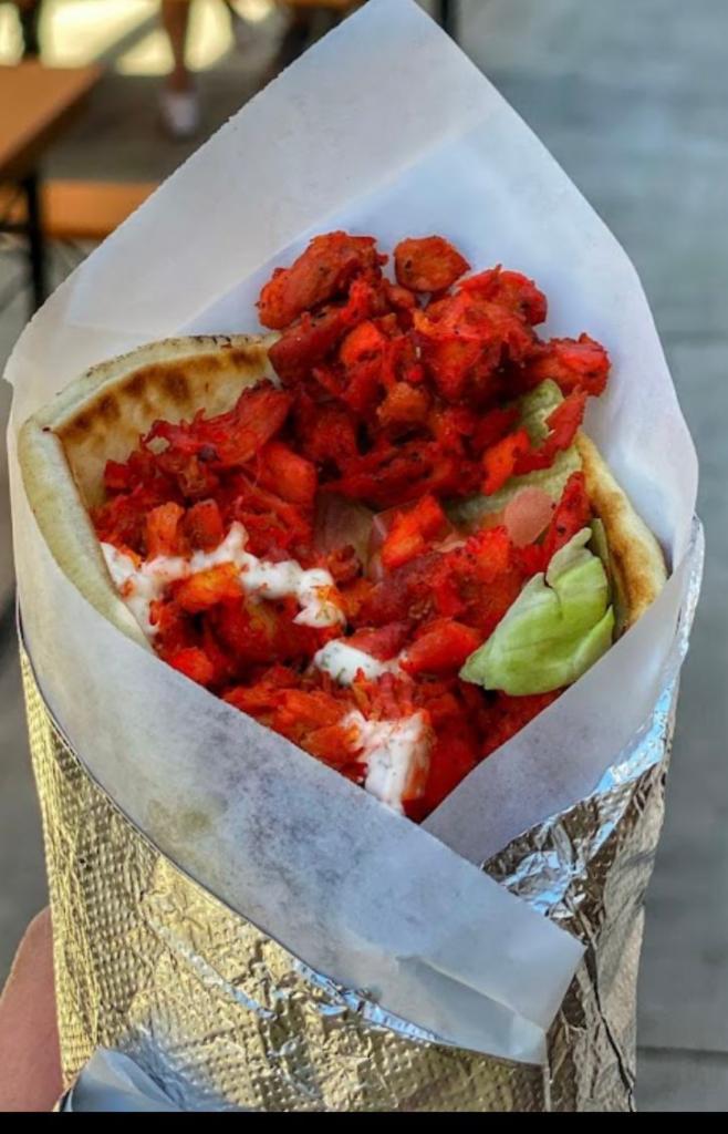 Chicken Gyro · All natural Halal chicken comes in a Pita with lettuce, Tomato, Onions, Cucumbers and White Sauce.
