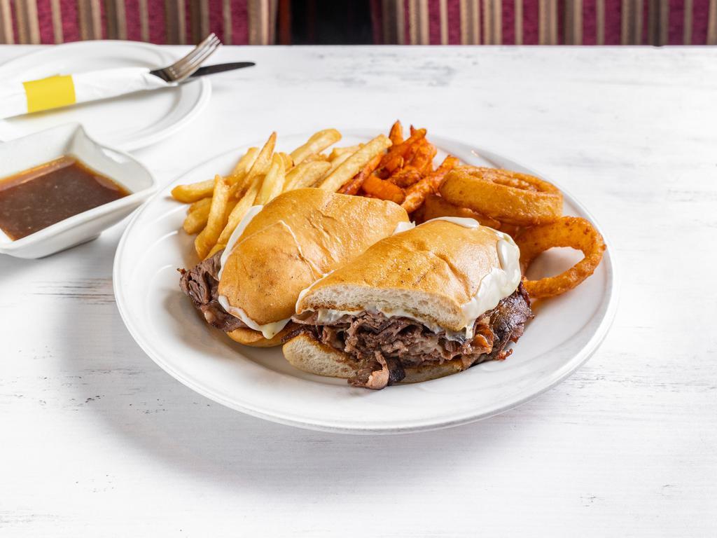 French Dip Supreme Sandwich Dinner · Roasted prime rib of beef sliced thin and piled high with melted mozzarella cheese on garlic bread and served with au jus.