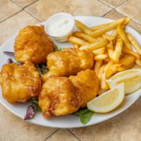 Fish and Chips Dinner · Beer-battered deep-fried cod served with tartar sauce and lemon.