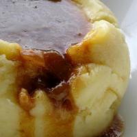 Mash and Gravy · Potatoes, butter, garlic, sour cream and brisket gravy.