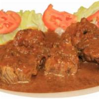 Carne Guisada  · Beef stew.