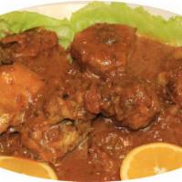 Pollo Guisado  · Chicken stew.