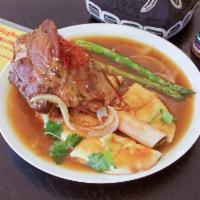 Braised Lamb Shank with Naan · Lamb Shank, Naan bread, Asparagus, Cilantro and decorated with White Sesame and Sliced dry r...