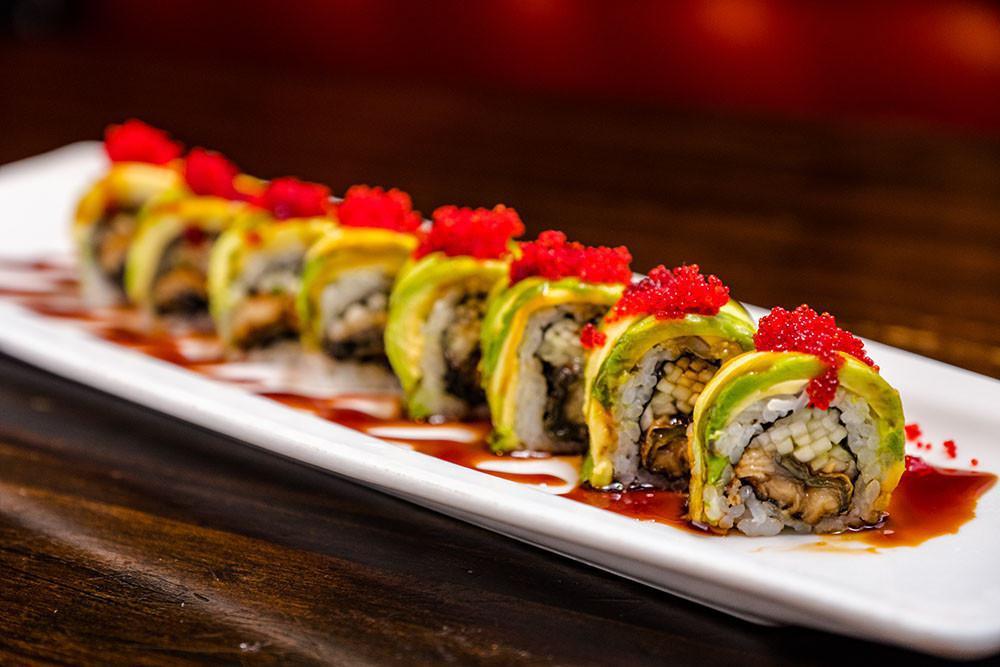 Classic Dragon Roll · Fresh water eel and cucumber roll, topped with avocado, kabayaki sauce and tobiko.