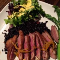 Pan-Roasted Duck Breast · Black rice w. Mandarin sauce and Asian vegetables.