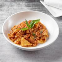 Pappardelle alla Bolognese  · Homemade pappardelle with Bolognese sauce.