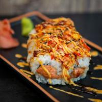 Volcano Roll · Spicy crunch tuna, topped with spicy BBQ crab, lemon mayonnaise, and eel sauce.