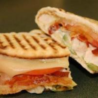 10. Chicken Club Panini  · Grilled chicken, bacon, brie cheese, plum tomatoes and house dressing. 