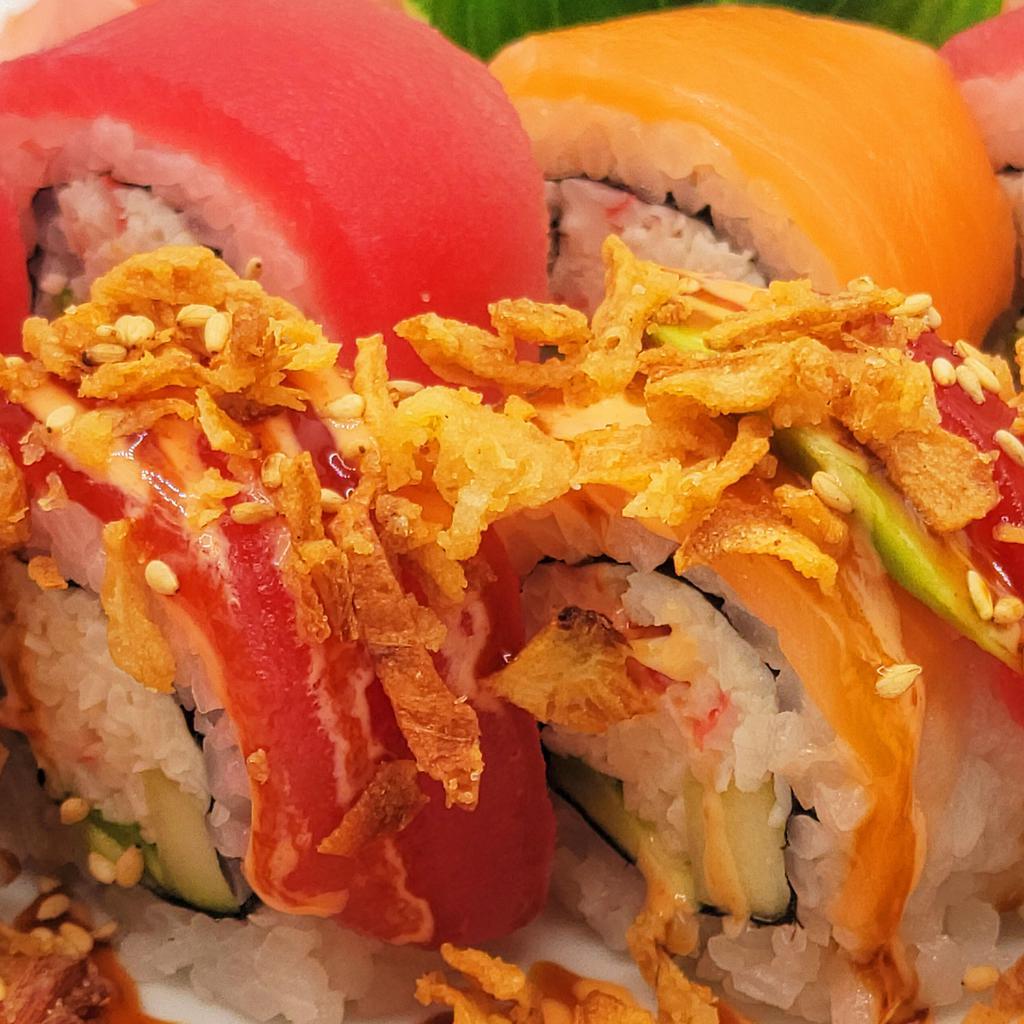 16. Rainbow Split Roll  · Rainbow roll topped with crunchy fried onion, spicy sauce and sweet sushi sauce.